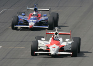 Sam Hornish Jr., front, pumps his fist after his pass of Marco Andretti on the run to the checkered flag, for victory in the Indianapolis 500 auto race at the Indianapolis Motor Speedway on Sunday, May 28, 2006, in Indianapolis. (AP Photo/John Raoux)