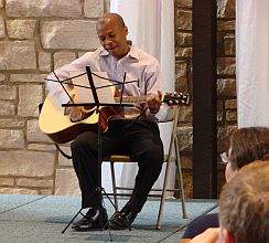 Dennis Webb playing guitar